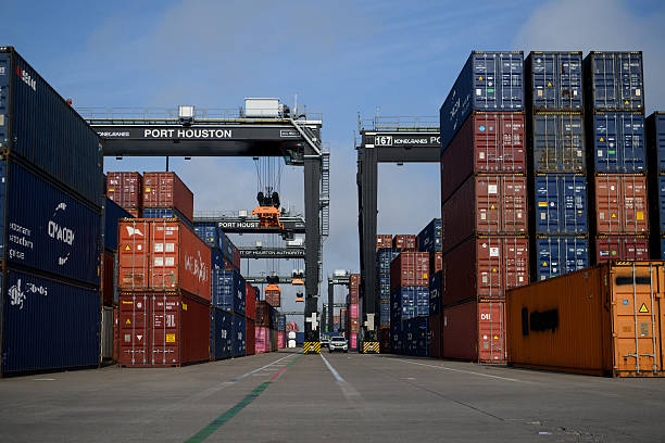 Stacked shipping containers in Bayport Terminal yard — legal representation for injured dockworkers and container yard employees in Houston, Texas