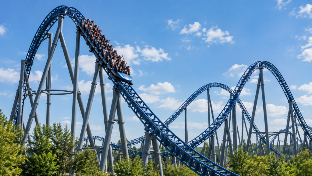 Roller coaster track and passenger train at an amusement park